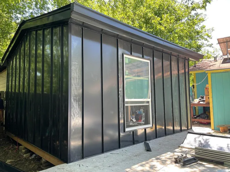 Black standing seam metal wall panels for Roof Inspection in Cannon